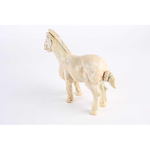 281 - A Chinese Han style white jade horse, Qing, 18th century or later, naturalistically modelled standin... 