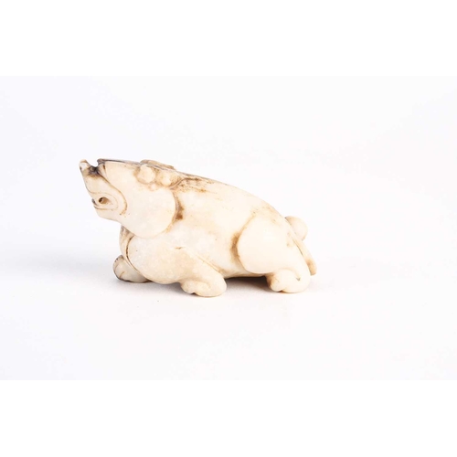 284 - A Chinese jade lion dog, Qing dynasty, late 19th century, modelled prowling with raised head, the st... 