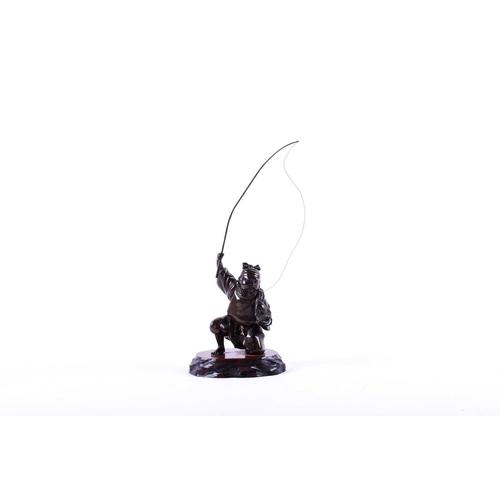 291 - A Japanese bronze figure of Ebisu, Meiji period, naturalistically modelled landing a fish, on wood b... 