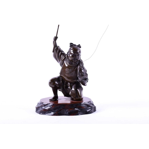 291 - A Japanese bronze figure of Ebisu, Meiji period, naturalistically modelled landing a fish, on wood b... 