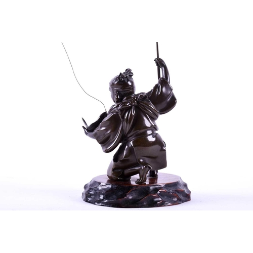 291 - A Japanese bronze figure of Ebisu, Meiji period, naturalistically modelled landing a fish, on wood b... 