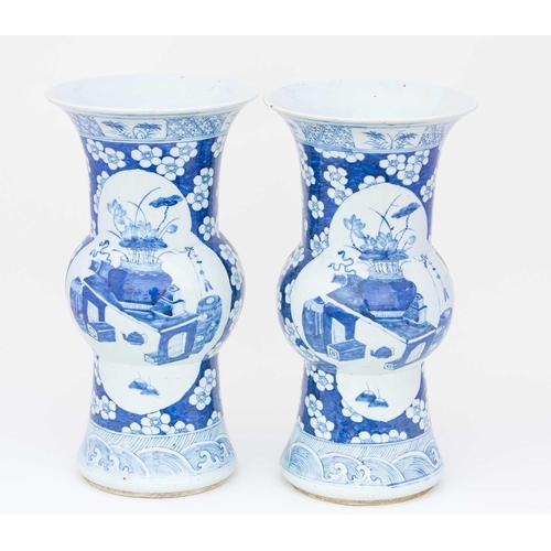 305 - A pair of Chinese blue & white Gu form vases, 19th century, decorated with quatrelobed panels of lot... 