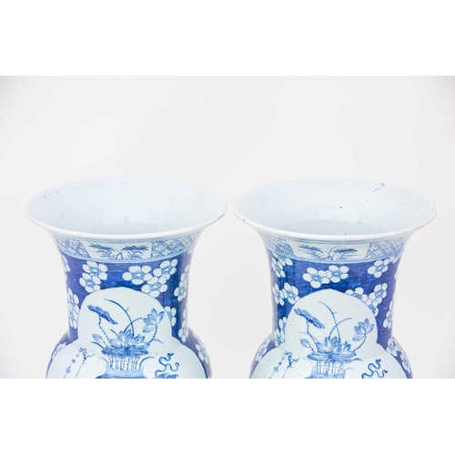 305 - A pair of Chinese blue & white Gu form vases, 19th century, decorated with quatrelobed panels of lot... 