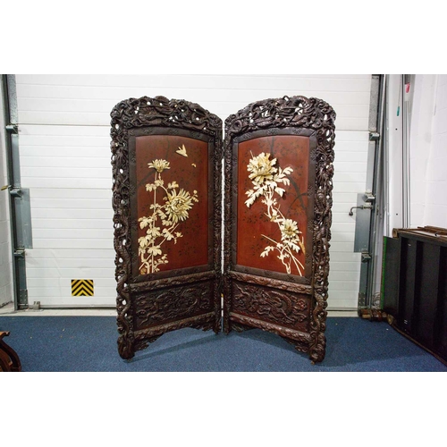 311 - A Japanese carved blackwood and ivory screen, Meiji period, circa 1880, the panels applied with high... 