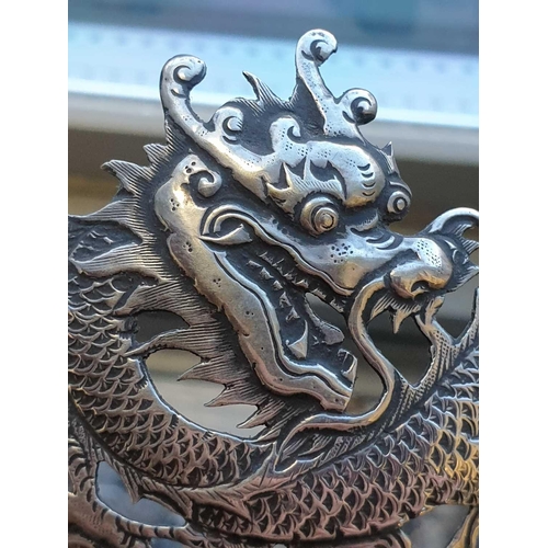 313 - A Chinese silver bowl, late 19th century, struck for undocumented maker WA, with three dragons among... 