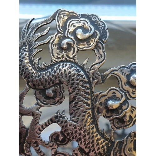 313 - A Chinese silver bowl, late 19th century, struck for undocumented maker WA, with three dragons among... 