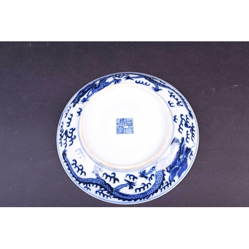 314 - A Chinese blue and white dragon dish, the interior painted with an imperial dragon and sacred pearl ... 