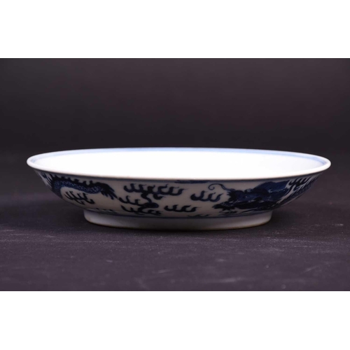 314 - A Chinese blue and white dragon dish, the interior painted with an imperial dragon and sacred pearl ... 