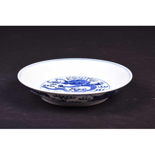 314 - A Chinese blue and white dragon dish, the interior painted with an imperial dragon and sacred pearl ... 