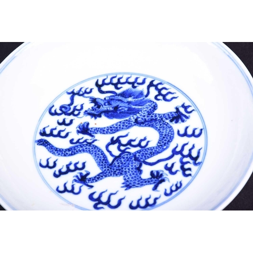 314 - A Chinese blue and white dragon dish, the interior painted with an imperial dragon and sacred pearl ... 