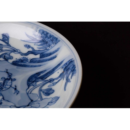 316 - A Chinese blue and white saucer dish, painted with a pheasant perched on rockwork surrounded by blos... 