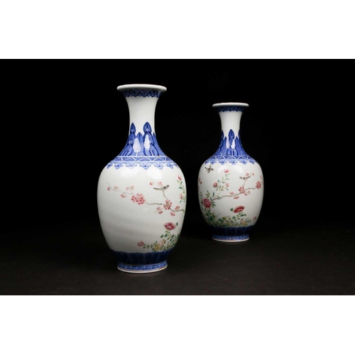 317 - A pair of Chinese Famille rose vases, the neck painted with a band of ruyi heads above a shoulder of... 