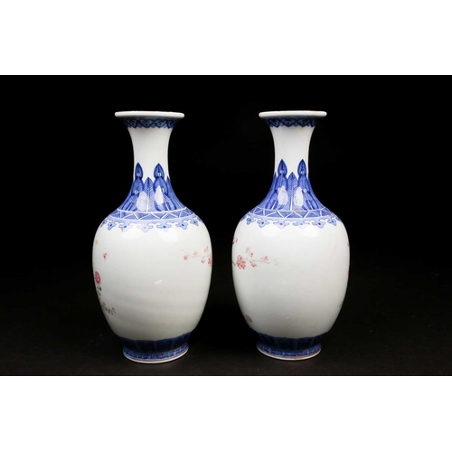 317 - A pair of Chinese Famille rose vases, the neck painted with a band of ruyi heads above a shoulder of... 