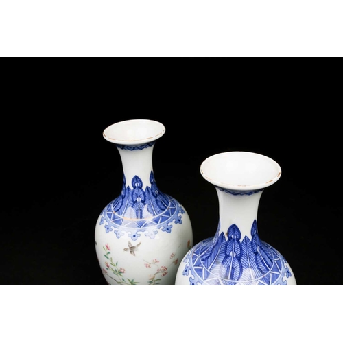 317 - A pair of Chinese Famille rose vases, the neck painted with a band of ruyi heads above a shoulder of... 