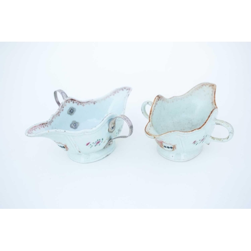 318 - A Pair of Chinese porcelain export armorial sauceboats, mid 18th century, of double ended boat shape... 