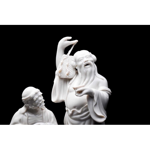 319 - A Chinese blanc de chine figure group of Lie Tieguai and Zhongli Quan, 20th century, each modelled w... 