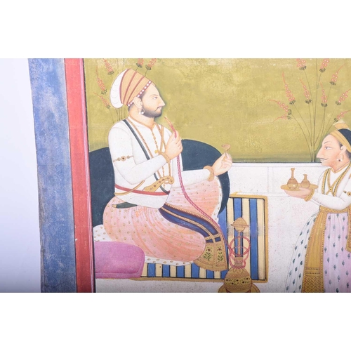 334 - Indian School, 19th century, A Shah with huqqa and attendant, within red and blue borders, gouache, ... 