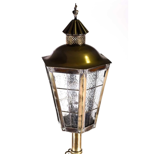 377 - An early 20th century polished brass standard lamp in the form of a street lantern, the lamp of hexa... 