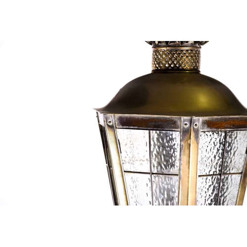 377 - An early 20th century polished brass standard lamp in the form of a street lantern, the lamp of hexa... 