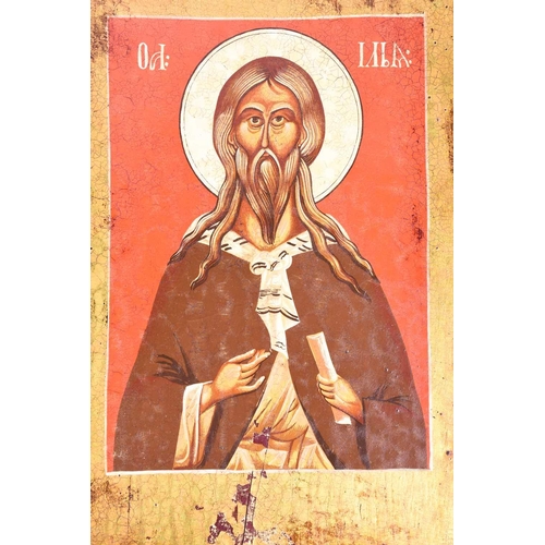 378 - A late 19th century Russian icon, canvas on wood, Christ Pantocrator, with cyrillic text within a da... 