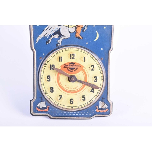 379 - A mid-20th century Soviet Russian Serdobsky tinplate pendulum clock showing Ivan the Fool on a humpb... 