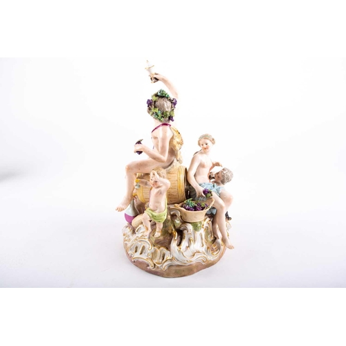 398 - A fine19th century Meissen figure group of Bacchus with children and a goat, he seated on a wine bar... 