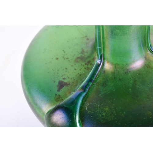 413 - An Art Nouveau design green glass vase, with applied trails and lustre finish, of compressed body fo... 