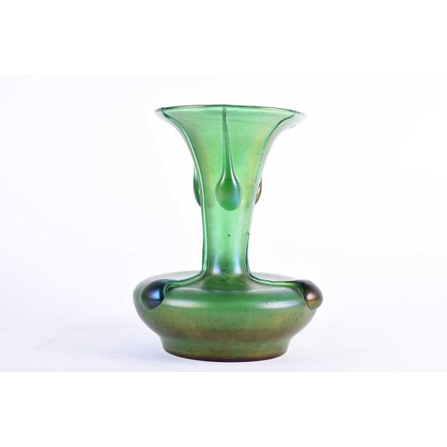 413 - An Art Nouveau design green glass vase, with applied trails and lustre finish, of compressed body fo... 