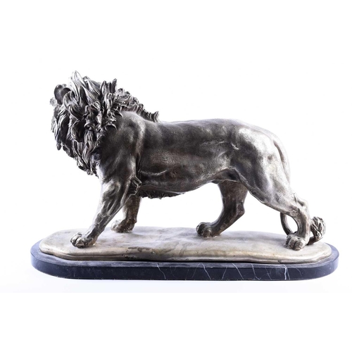 415 - A cast nickel lion, 20th century, modelled standing, on a black marble base, 49cm wide, 30cm high