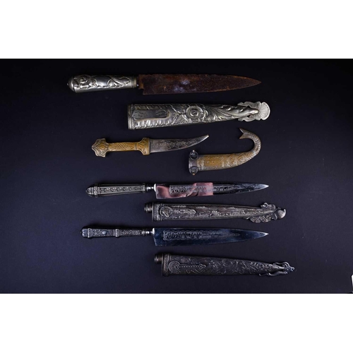 419 - Three Gaucho knives, two with white metal embossed handles and scabbards, one of which marked for Ab... 