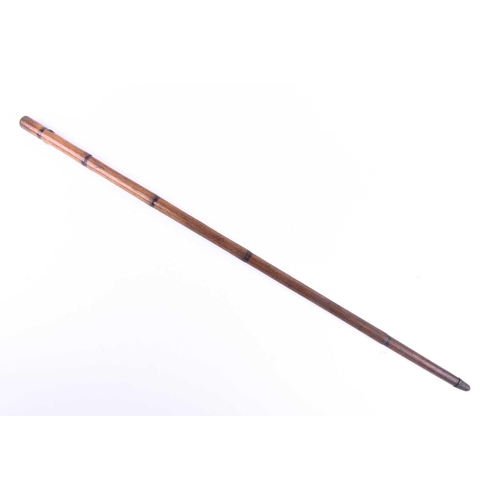 432 - A 19th century swordstick, in bamboo cane, the terminal with stipple section above metal mounted lan... 