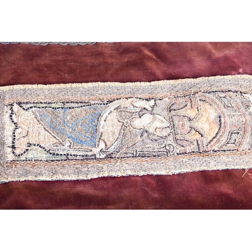 447 - An 18th century embroidered orphrey fragment depicting three saints, the panels in stump type work w... 