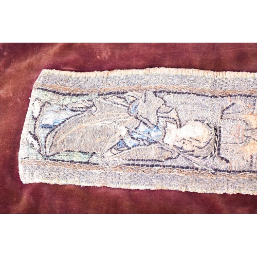 447 - An 18th century embroidered orphrey fragment depicting three saints, the panels in stump type work w... 