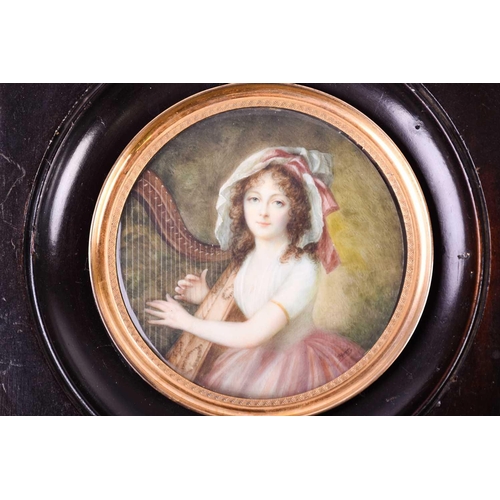 454 - Lié Louis Périn (1753-1817) French, a circular portrait miniature on ivory, a young lady playing a h... 