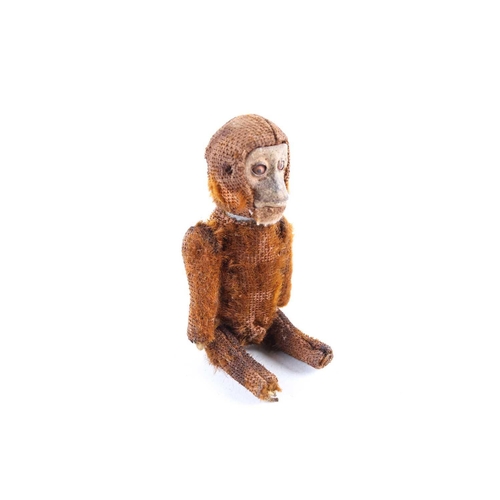 482 - An early 20th Schuco Monkey perfume bottle, with dark brown plush fur and articulated joints, 11.5cm