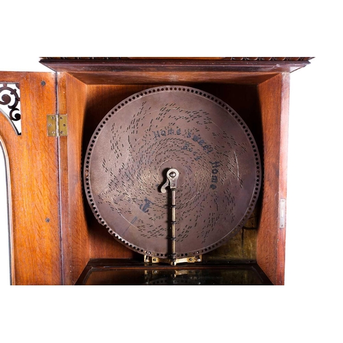 489 - An impressive Victorian mahogany 'Penny in the Slot' Polyphon on associated stand, the arched glazed... 