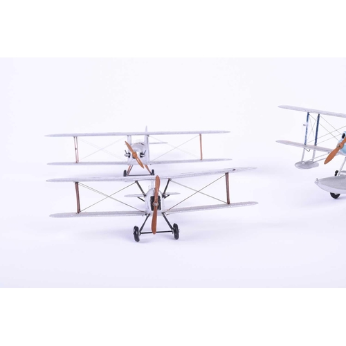 494 - A group of five W. O. Doylend miniature hardwood bi-planes, built to a scale of one inch to six feet... 