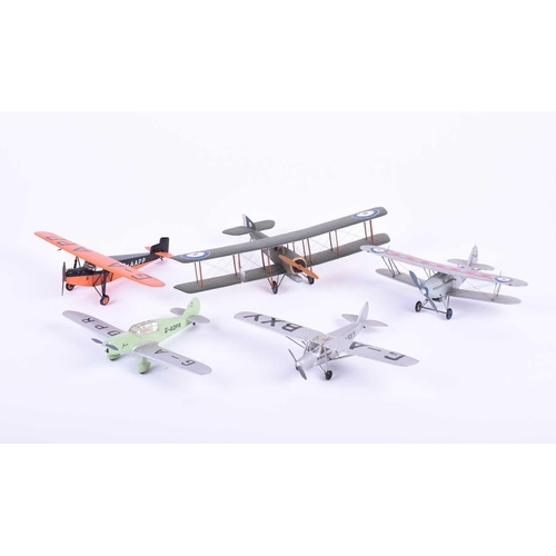 497 - A group of five W. O. Doylend miniature hardwood model airplanes, built to a scale of one inch to si... 