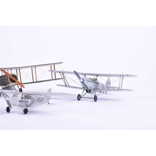 497 - A group of five W. O. Doylend miniature hardwood model airplanes, built to a scale of one inch to si... 