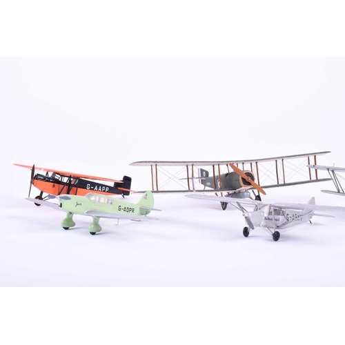 497 - A group of five W. O. Doylend miniature hardwood model airplanes, built to a scale of one inch to si... 