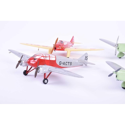 498 - A group of five W. O. Doylend miniature hardwood model airplanes, built to a scale of one inch to si... 