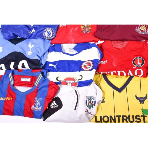 519 - A large collection of official club football shirts, polo shirts and jackets, adult sizes from vario... 