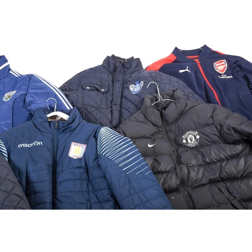 519 - A large collection of official club football shirts, polo shirts and jackets, adult sizes from vario... 