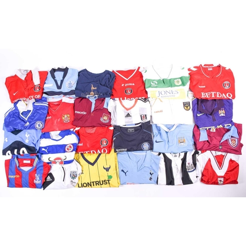 519 - A large collection of official club football shirts, polo shirts and jackets, adult sizes from vario... 