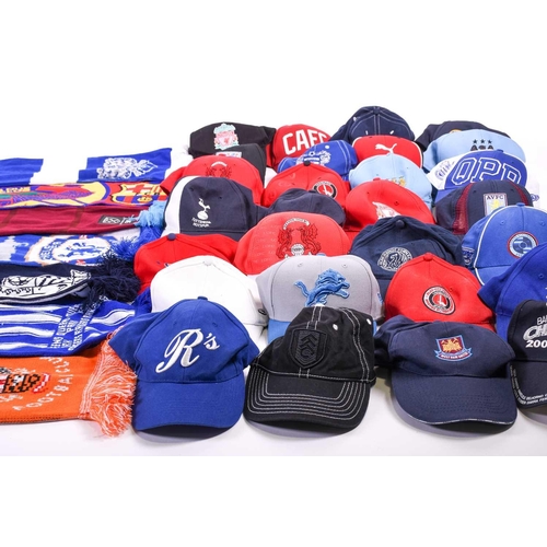 520 - A large collection of official club-issued football caps and scarves, to include examples from Liver... 