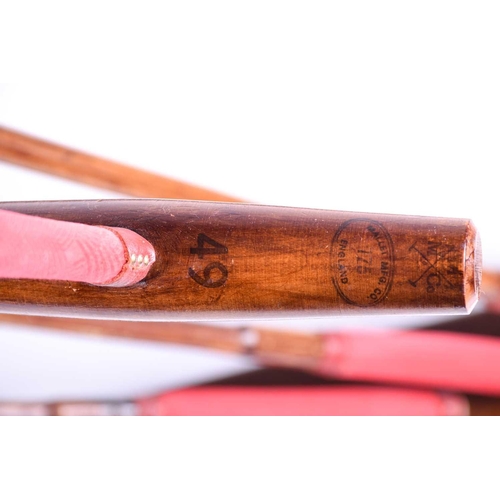 521 - A set of six polo mallets, with bamboo shafts, the head stamped for the Mallet MFG Co, England, disp... 