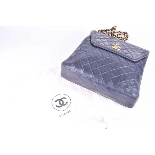 524 - Chanel. A classic quilted leather handbag, of tapered square design, with gold tone CC logo clasp, a... 