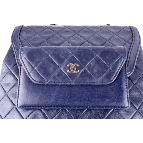 524 - Chanel. A classic quilted leather handbag, of tapered square design, with gold tone CC logo clasp, a... 