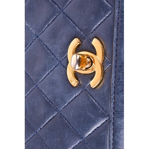 524 - Chanel. A classic quilted leather handbag, of tapered square design, with gold tone CC logo clasp, a... 