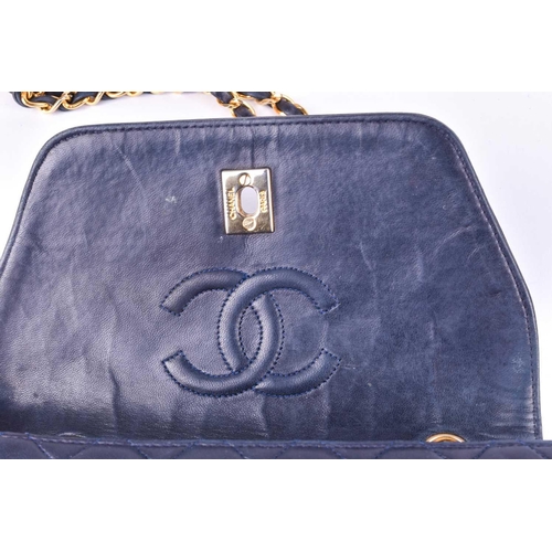 524 - Chanel. A classic quilted leather handbag, of tapered square design, with gold tone CC logo clasp, a... 